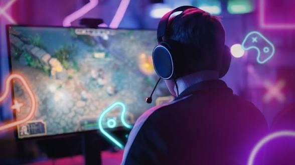African gamer streaming and competing professionally on a gaming setup with multiple monitors and esports equipment