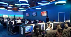 Indie game developers working on a video game project inside a modern game studio setup with multiple monitors and design software